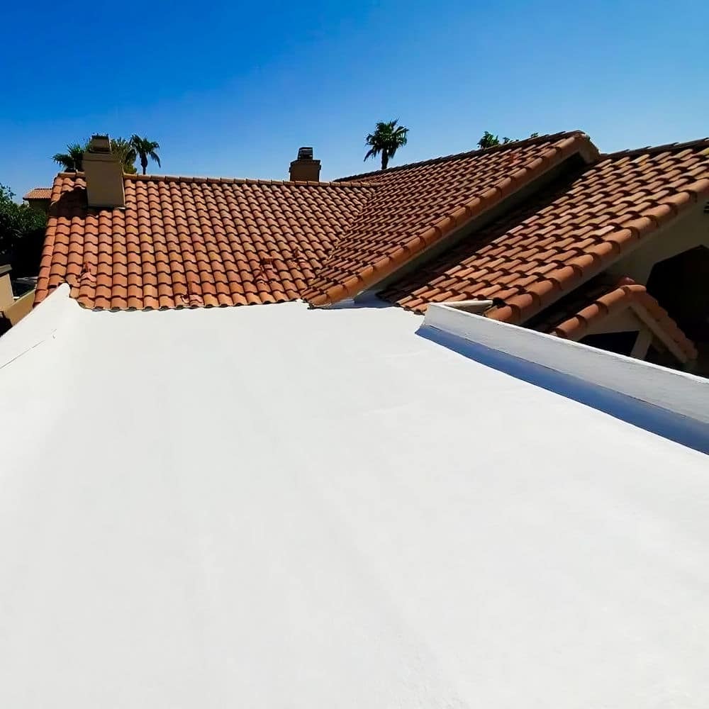 building with both a shingled and flat roof