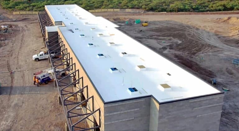 large storage building with a flat TPO roof