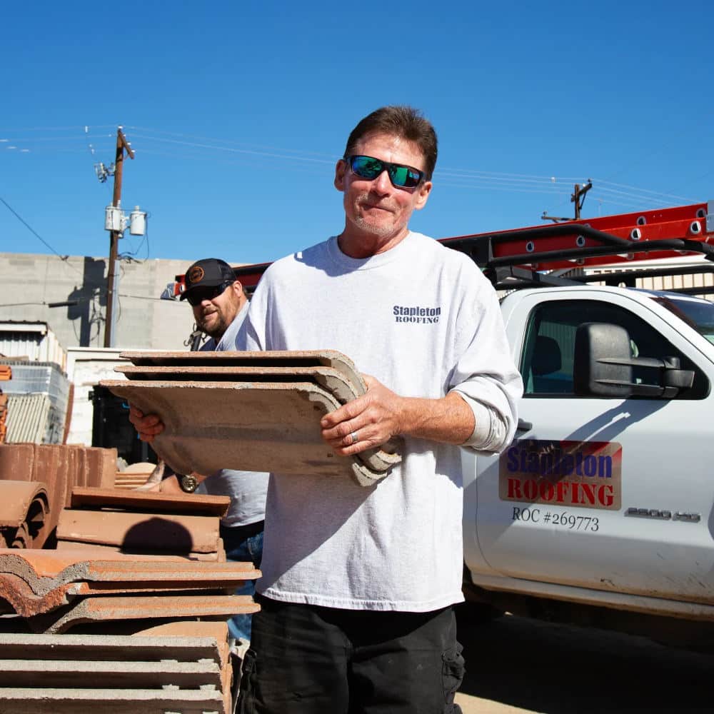 tile roof contractors working on a tile roof