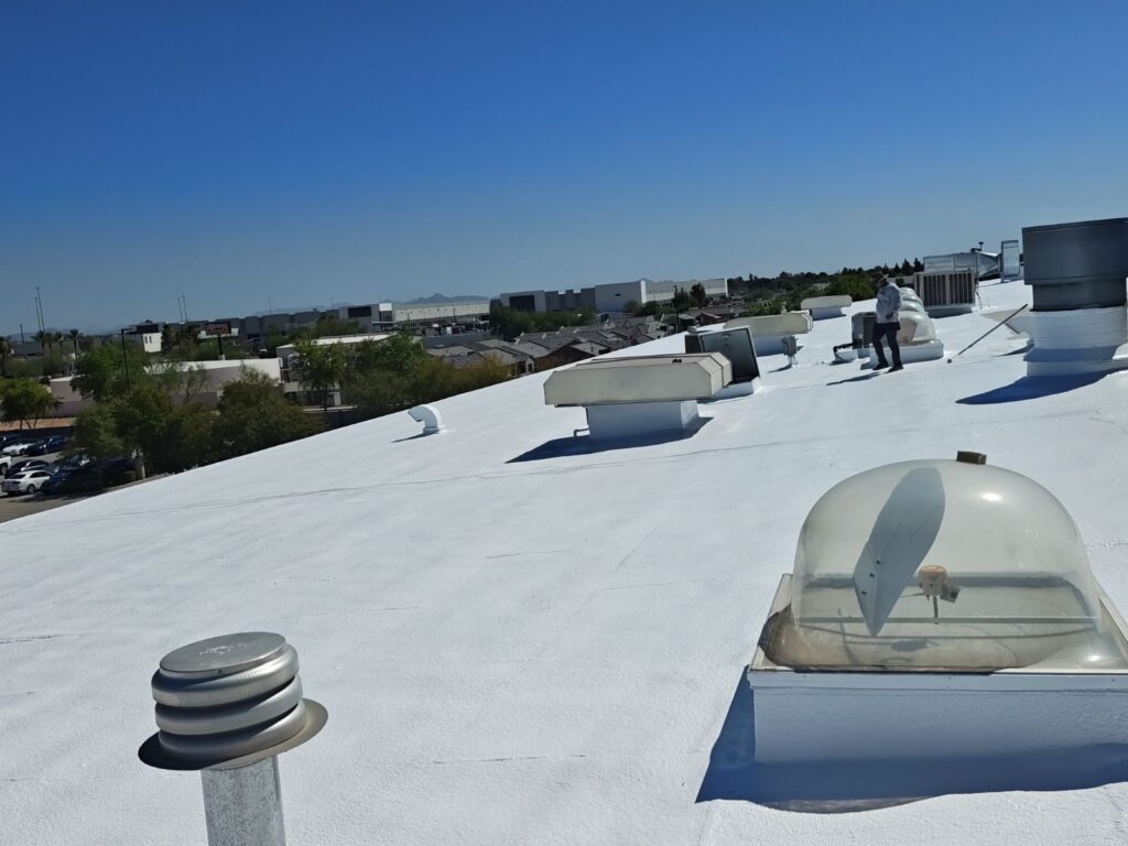 Completed reflective foam roof coating on commercial building Phoenix AZ